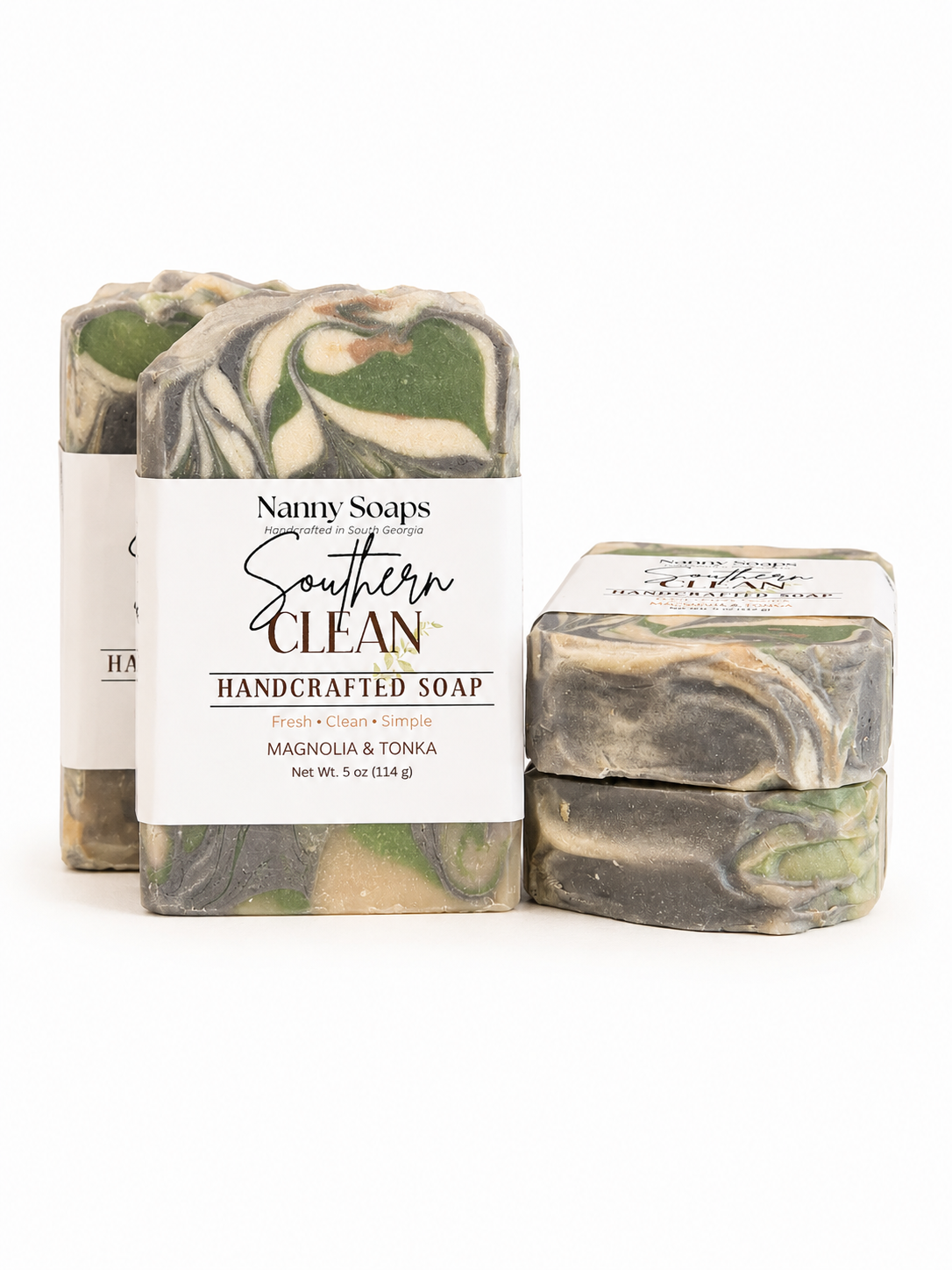 Handcrafted soap bars with visible branding on a white background
