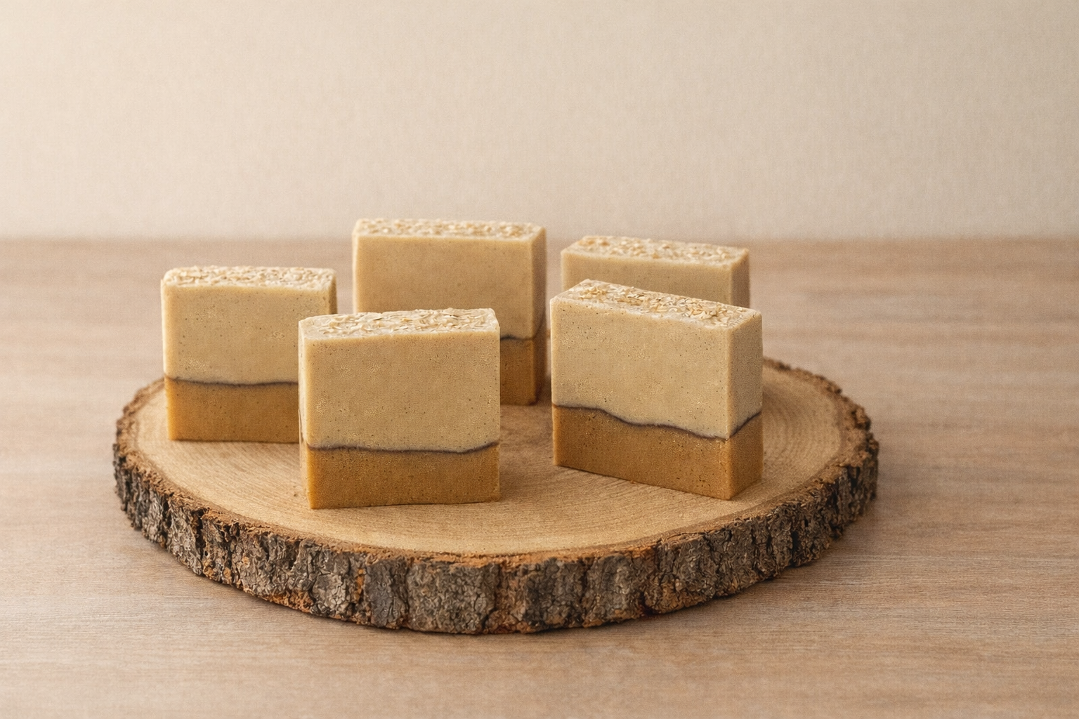 Five layered square candies on a wooden board with a neutral background