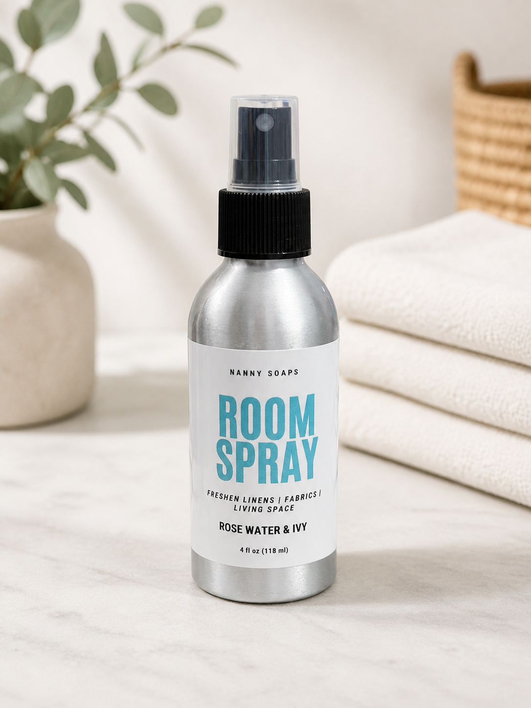 Room spray bottle with a white label on a neutral background