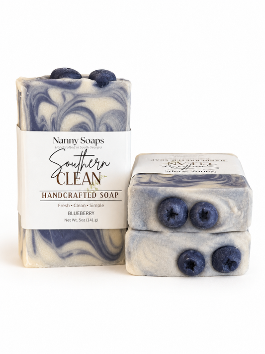 Two bars of blueberry-scented soap with packaging on a white background