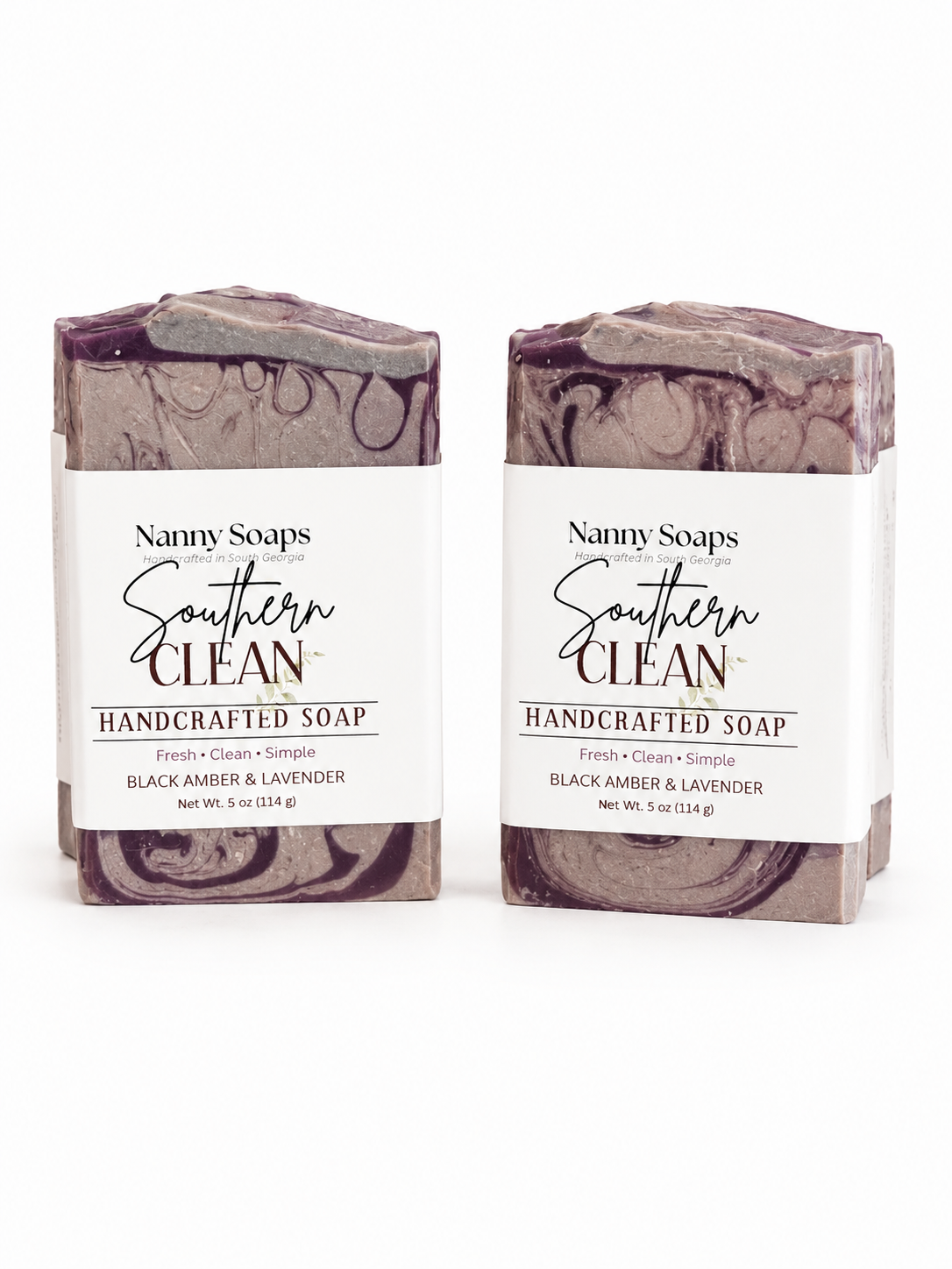 Two bars of Nanny Soaps Southern Clean handcrafted soap on a white background