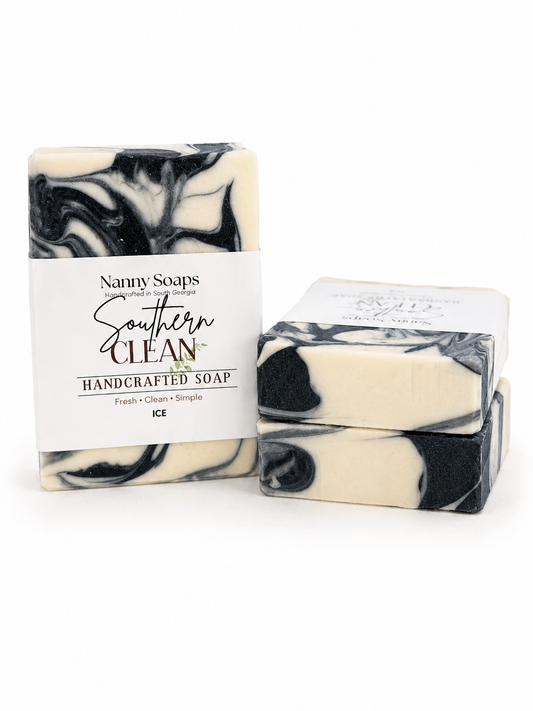 Handcrafted soap with black and white marbled pattern and Nanny Soaps packaging on a white background